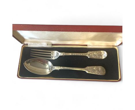 A near pair of profusely engraved Victorian spoon and fork, by George Adams, London, 1863/4, 1865/6, 93g