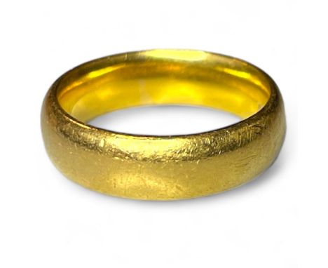 A 22ct yellow gold band ring. Size N. Approximate weight 10.79 grams.