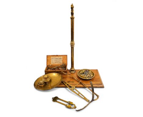 A set of brass scales on mahogany stand by day and millward with weights 51cm x 26cm x 60cm tall and a set of Vandome, Titfor