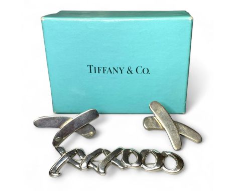 A Paloma Picasso for Tiffany &amp; Co silver brooch, 'Graffiti Love' and two silver cross earrings marked 925.&nbsp;