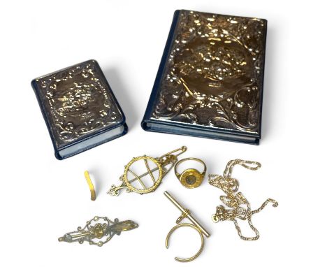A collection of gold jewellery and two silver fronted books. To include items of 9ct gold including a "9ct" stamped sovereign