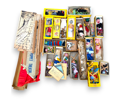 A collection of nineteen boxed Pelham puppets, including The Dragon, a boxed Barnsbury puppet, five loose puppets and a stage