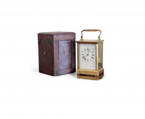 A brass carriage clock, striking on a gong retailed by Goldsmiths &amp; Silversmiths Co 112 Regent Street, London. 9.5cm by 8