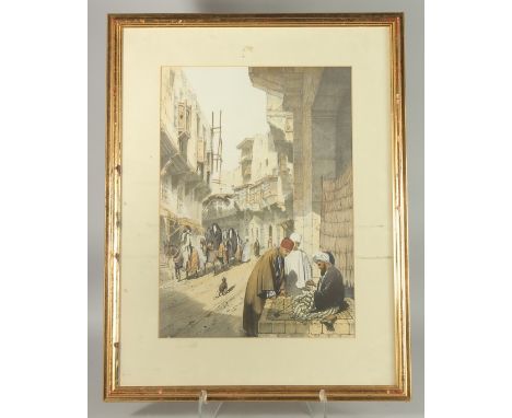 A LITHOGRAPH PRINT OF A TURKISH STREET SCENE, framed and glazed, image 49cm x 35cm.