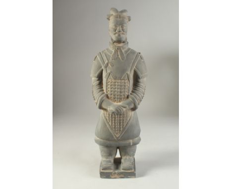 AN ANTIQUE POTTERY TERRACOTTA ARMY WARRIOR REPLICA FIGURE, 44cm high.
