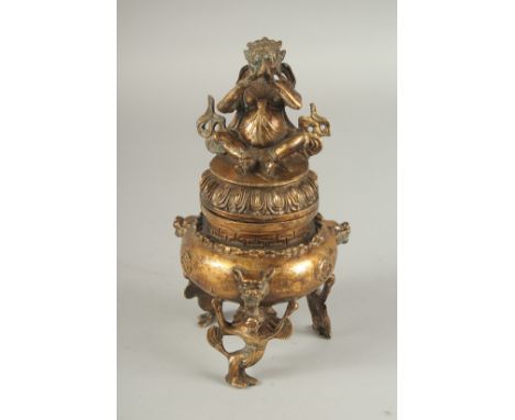 A SOUTH EAST ASIAN GILDED WHITE METAL TRIPOD CENSER AND COVER, character mark to base, 20cm high.