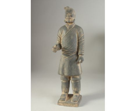 AN ANTIQUE POTTERY TERRACOTTA ARMY WARRIOR REPLICA FIGURE, 44.5cm high.