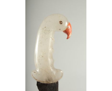 A CARVED ROCK CRYSTAL HILTED DAGGER, the handle formed as a bird head with wavey engraved blade, 37cm long.