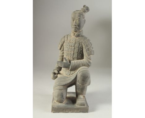 AN ANTIQUE POTTERY TERRACOTTA ARMY WARRIOR REPLICA FIGURE, 34cm high.