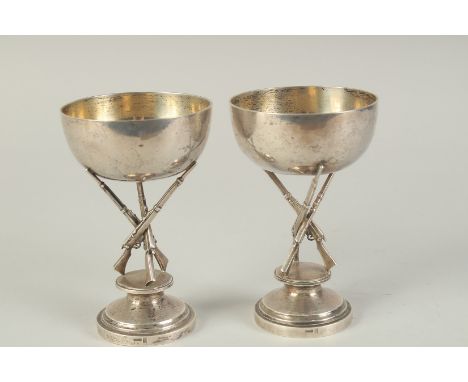 A PAIR OF CHINESE SILVER HUNTING RIFLE FOOTED CUPS, hallmarks to the foot rim, 14.5cm high.