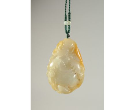 A CHINESE CARVED JADE PENDANT, 5cm x 3.5cm.