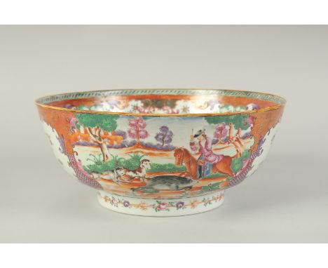 A CHINESE EXPORT FAMILLE ROSE PORCELAIN HUNTING SCENE PUNCH BOWL, painted with European figures on horseback, the interior pa