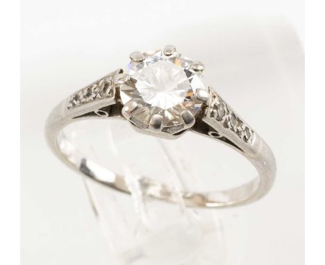 PLATINUM DIAMOND SOLITAIRE RING, the single claw set stone measuring 0.75cts approx., diamond chip shoulders, ring size K, 2.