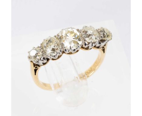 18CT GOLD & PLATINUM FIVE STONE DIAMOND RING, the five graduated old European cut stones measuring 1.5-1.6cts overall approx.