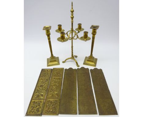 Arts & Crafts adjustable brass four branch table candelabra with knop finial, part twisted stem on tripod base with lion paw 