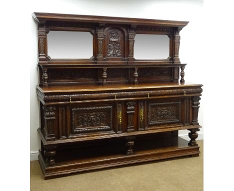 Large Victorian oak sideboard, raised back with bevel edge mirror plates. single shelf above moulded top, with two carved fri