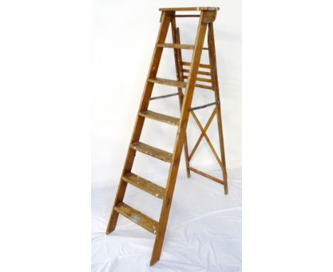SET OF VINTAGE PINE STEP LADDERS
with seven steps and folding metal support stretcher, 168cm high