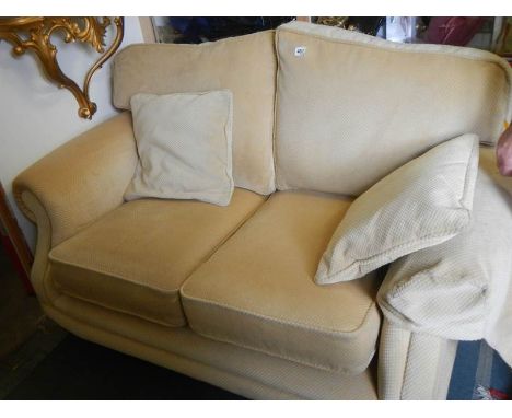 A good two seat sofa on brass castors, COLLECT ONLY,.