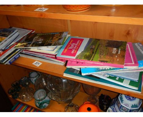 A quantity of Ordnance survey maps and guide books.