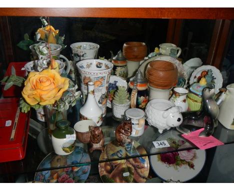 A shelf of assorted ceramics.