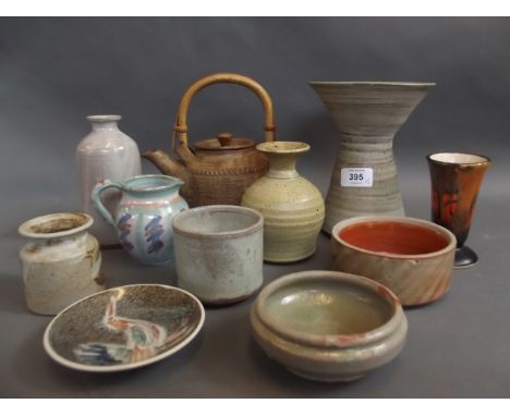 A studio pottery reverse painted candlestick, a rustic teapot, and nine other studio pottery items, candlestick 7" high 