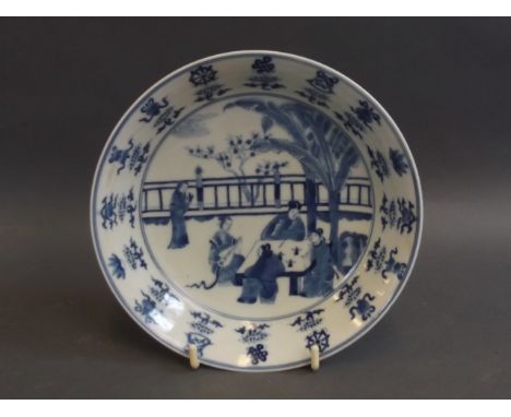 A good Chinese blue and white porcelain dish with painted decoration of nobles being entertained by a musician, symbols to bo