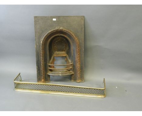 A Victorian cast iron fire surround with grape and vine decoration, and a pierced brass fender, 26" x 36", Best Bid 
