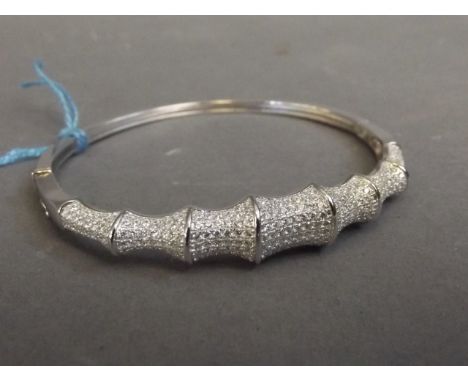 A silver and cubic zirconia set bangle in the form of bamboo, 2½" wide 