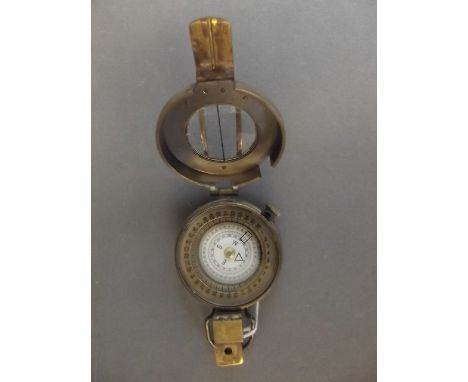 A brass sighting compass, marked 'T.G. & Co., London', 2½" diameter 