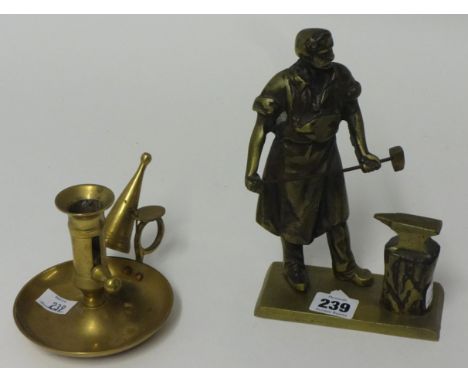 Brass sculpture of a Blacksmith and a brass chamber stick (2).