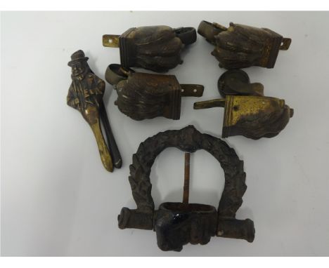 Pair of brass nutcrackers, Antique iron door knocker, Set of antique brass furniture castors.