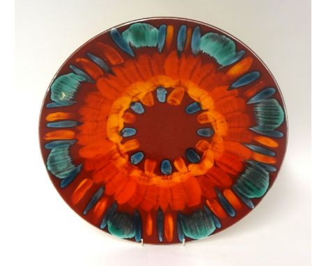 A Poole Art Pottery Delphis charger, diameter 41cm.