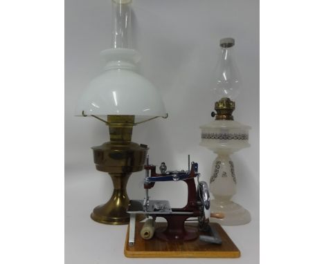 Victorian opaline glass oil lamp, brass oil lamp and a miniature sewing machine with case (3).