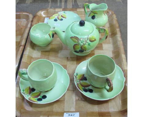 Carltonware 'tea for two' set on a green ground and decorated with berries and foliage, with floral handles.  Printed marks t
