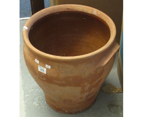 Large baluster two handled terracotta planter.