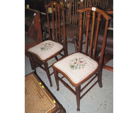 Pair of Edwardian mahogany inlaid bedroom chairs, having tapestry floral seats. (2)