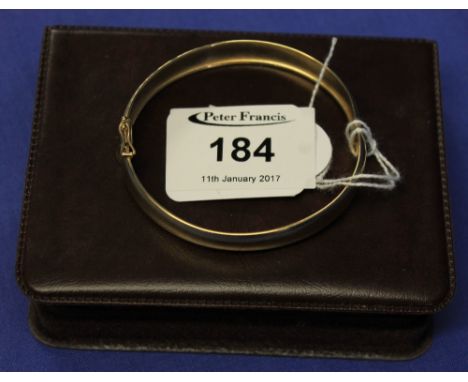 9ct gold scroll engraved bangle in associated box. CONDITION REPORT: Weight - 7.7g approximately