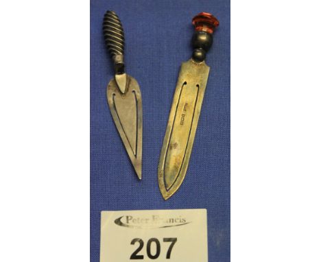 Two silver book marks, one in the form of a trowel, the other gem set. (2) CONDITION REPORT: Both grubby/stained. Minor dinks