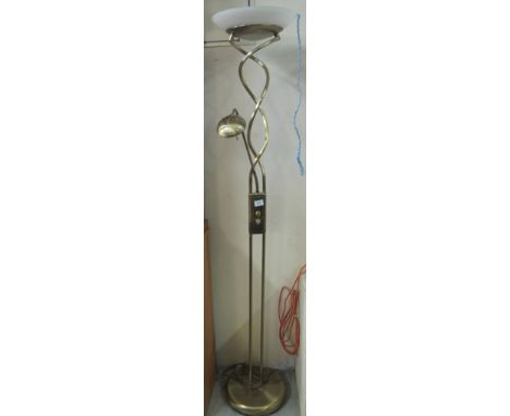 Modern brass finish standard lamp on circular base.