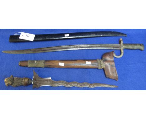 French 1879 pattern bayonet and scabbard together with a Malay Kris dagger and scabbard. (2) CONDITION REPORT: Kris - very dr