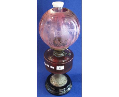 Early 20th Century brass double burner oil lamp with cranberry glass shade, fluted brass pedestal and ceramic base, etched gl
