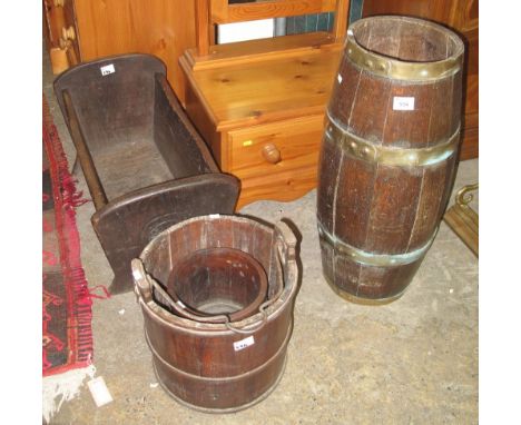 Vintage oak brass banded coopered barrel together with an oak pail with iron swing handle, oak planter and carved oak baby's 