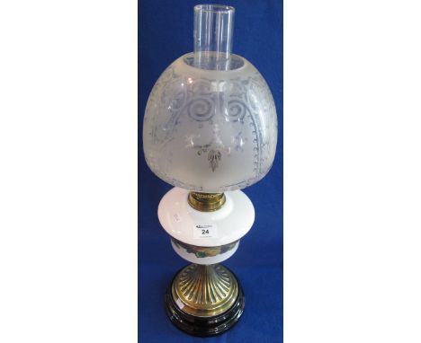 Early 20th Century brass double burner oil lamp, having ceramic reservoir with fruit decoration on a fluted brass pedestal wi