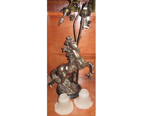 Oxidised metal table lamp in the form of a rearing horse, with two frosted glass shades.