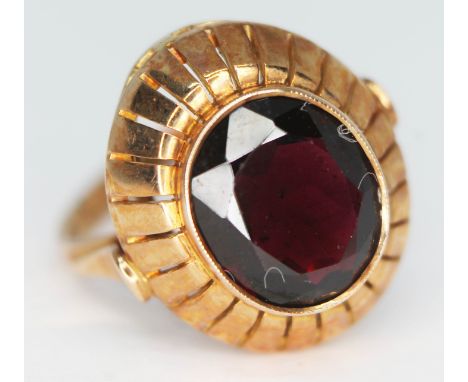 A garnet set ring, marked '585', gross wt. 5.18g, size M.  