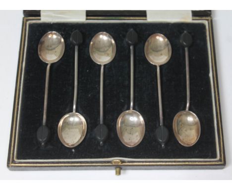 A cased set of six hallmarked silver bean spoons.  