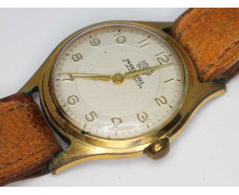 A vintage 1950s Ingersoll gold plated wristwatch with signed champagne guilloche dial, gold tone Dauphine hands, Arabic numer