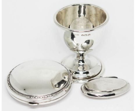 A mixed lot of hallmarked silver comprising a compact, a pill box and an egg cup.  