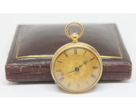 A Victorian hallmarked 18ct gold open faced pocket watch with engine turned dial having Roman Numerals and elaborately engrav