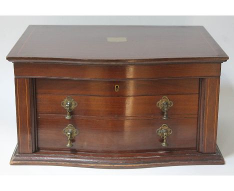 An Edwardian inlaid mahogany canteen of silver plated cutlery, with inset brass campaign style handles, lift top and two draw